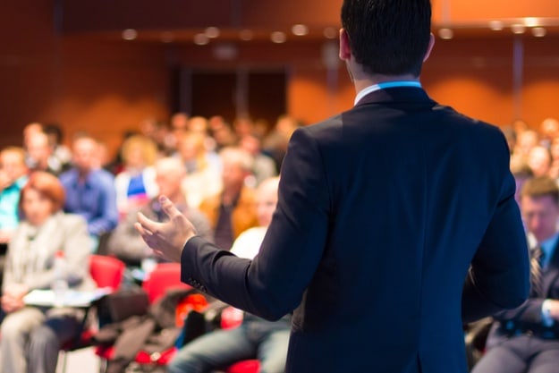 Step 5: Online presentations should factor in interaction with the audience | Online Presentation That Sells | Tips On How to Create One | online presentation | speaker talking to an audience
